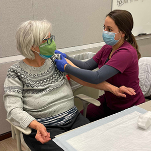 Reading Hospital School of Health Sciences Nursing Student Sarah Rodriguez working at the COVID-19 Vaccination Clinic