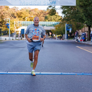 Dr. Barbera crosses the finish line at the 2023 Reading Hospital Road Run in West Reading, PA.