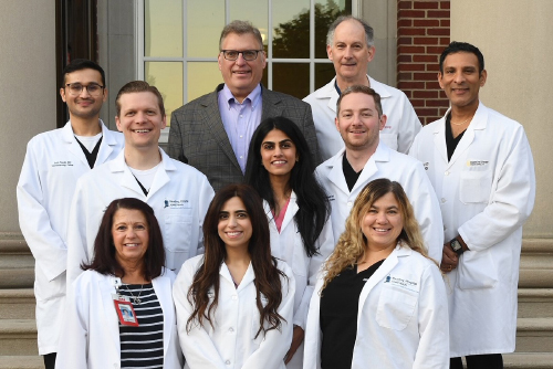 The 2024 fellows in the Gastroenterology Fellowship along with faculty, standing on the steps of Reading Hospital