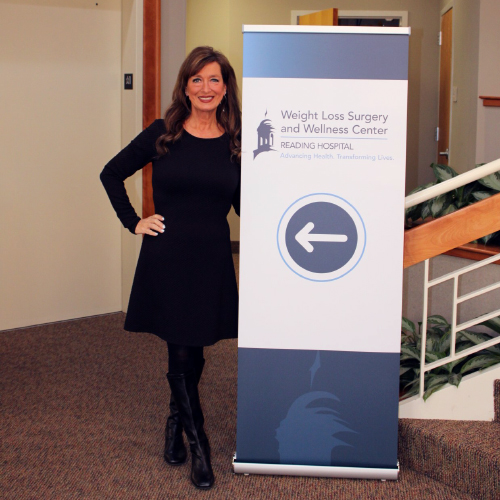 Kimberley Mazza smiles in front of the Reading Hospital Weight Loss Surgery and Wellness Center.