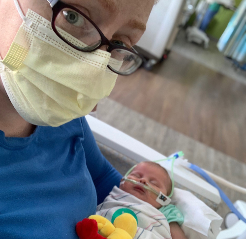 Baby Pierce sleeping in Mom's arms at St. Christopher's Hospital for Children