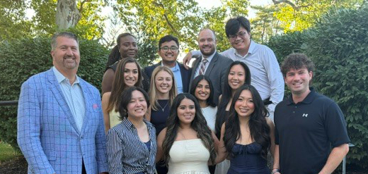 Group of medical professionals posing outside in group photo