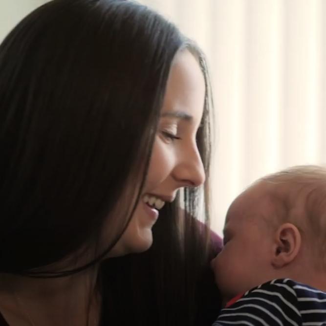 woman kissing baby