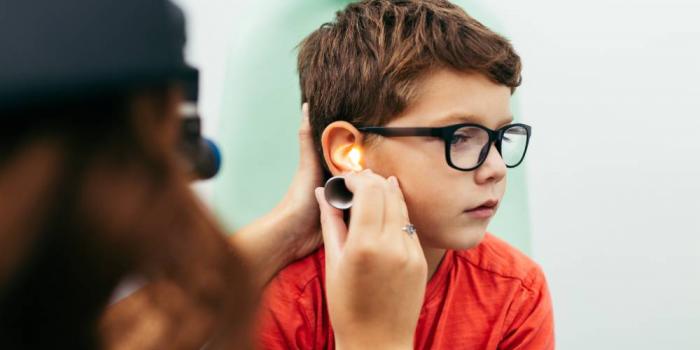 Boy getting ear exam