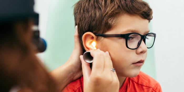 Boy getting ear exam