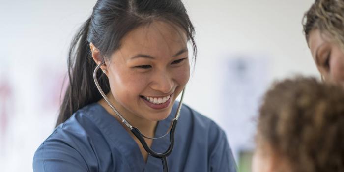 Nurse listening to baby's heart