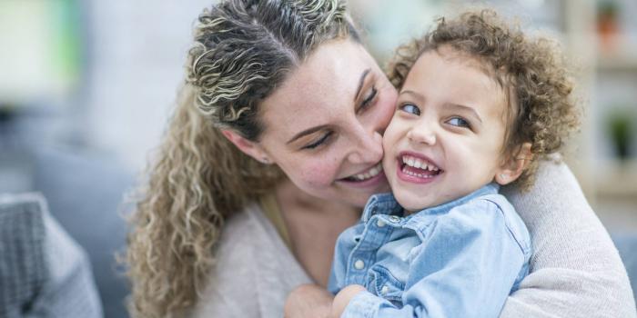 Mom and toddler laughing