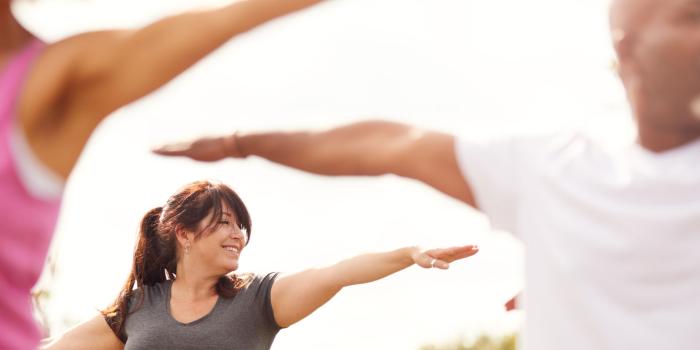 Group of people exercising outside/