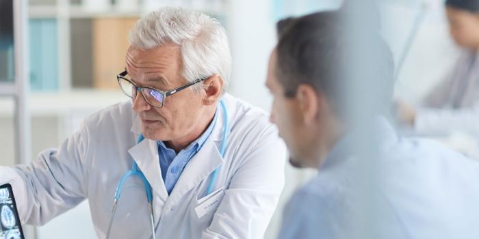 Doctors looking at a screen