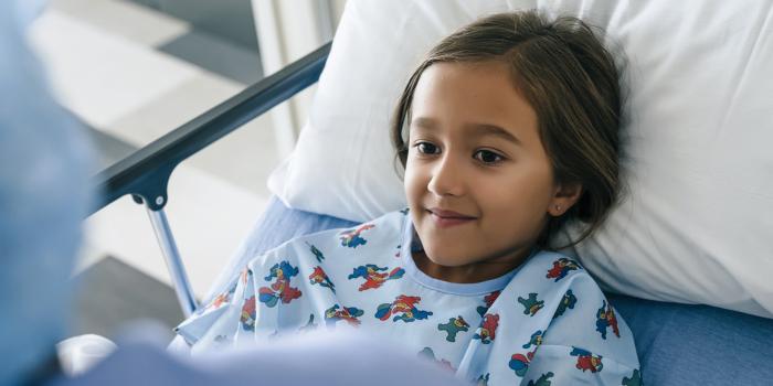 Girl in hospital bed