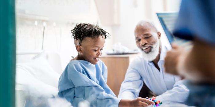 Grandpa visiting his grandson in the hospital 